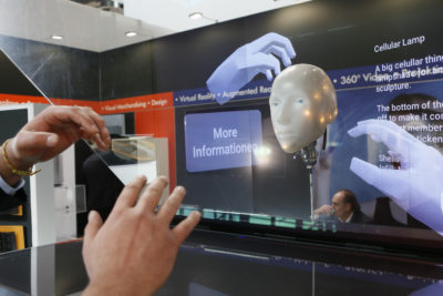 Two hands control images on a clear screen