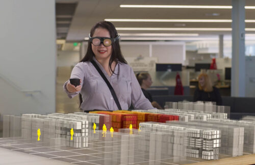 A woman uses a digital twin of the store with augmented reality; Copyright: Lowe's