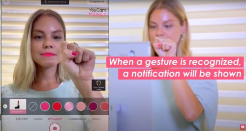 A woman controls an app for trying out cosmetics with gestures