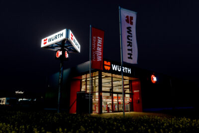 A hardware store at night from the outside