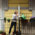 Woman watering the flowers on the neighbouring balcony; copyright: nebenan.de
