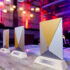 Three EuroShop RetailDesign Award trophies side by side