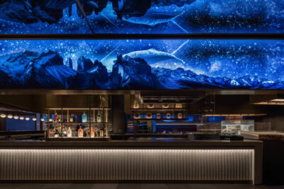 a long bar counter above with a mysterious underwater picture