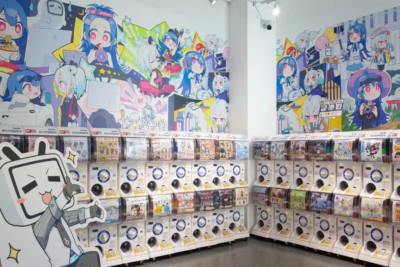 View into a corner of a store where animés are painted on the walls