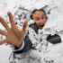 Businessman sinks into a pile of documents; copyright: PantherMedia / Nomadsoul1