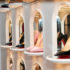 A shoe shelf with small archways and luxury womens' shoes