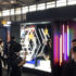 Exhibition stand with lighting elements and visitors in front; copyright: Messe Düsseldorf