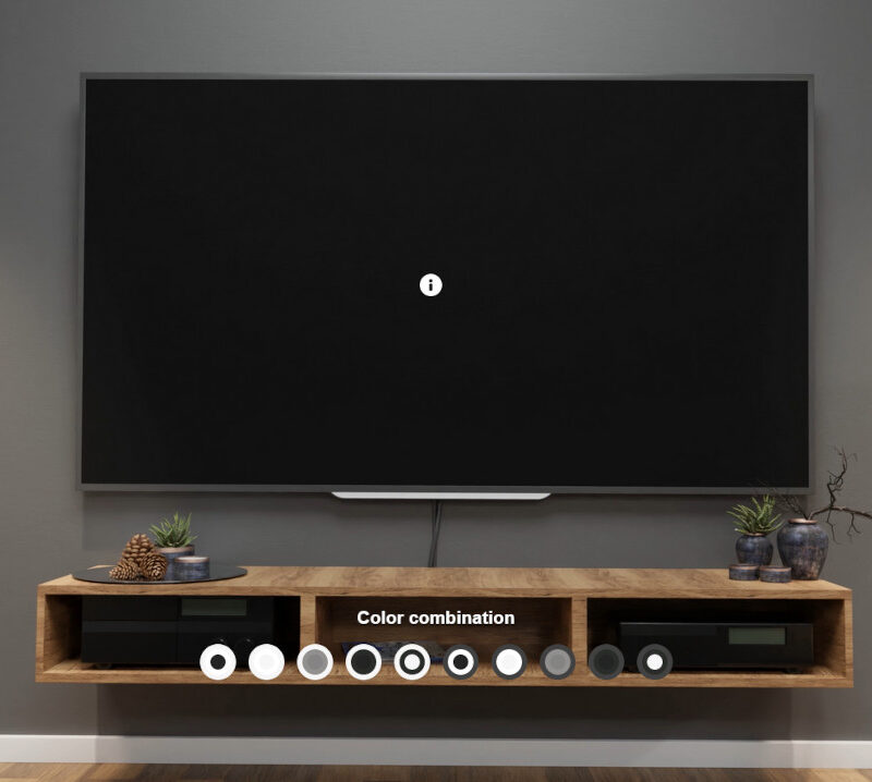 A TV set mounted on a wall with two speakers
