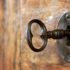 Close-up of an old keyhole with key; copyright: PantherMedia / anskuw