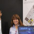 Two exhibitors smiling at their booth; copyright: beta-web/Klein