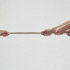 One hand pulling on a rope against several other hands on the other side of it