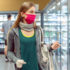A young woman with a red facemask in a supermarket