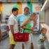 Family with a child looking into refrigerated cabinets in a supermarket; copyright: PantherMedia/danr13