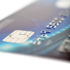 A lying credit card against a white background; copyright: PantherMedia/mikhailkhusid