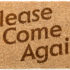 Doormat with writing on it “Please come again”; copyright: panthermedia.net/Feverpitch