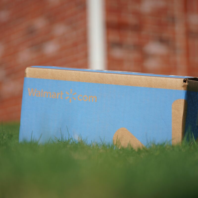 Delivered Walmart package lies on lawn; Copyright: Walmart