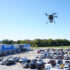 Walmart DroneUp drone flies over a parking lot; Copyright: Walmart.